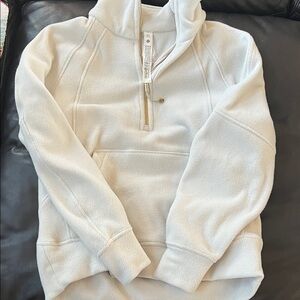 Lululemon  Cream Pullover half zip hoodie with gold zipper.